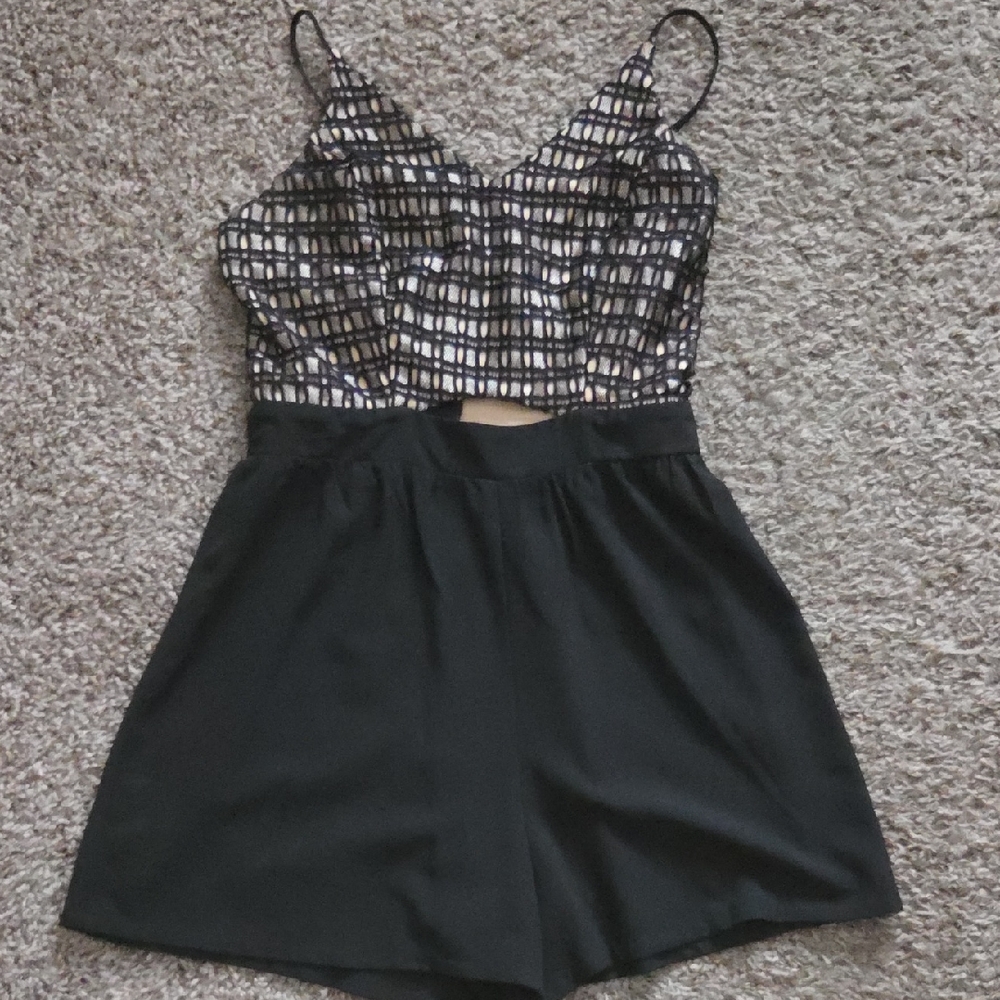 Black and cream romper with key hole cut out in the front